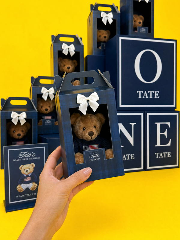 Collection of teddy bears in blue boxes with 'Tate' branding on a yellow background. We created the boxes with a 'Ralph Lauren' theme.